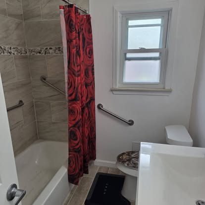 Bathroom with safety rails at American Golden Care